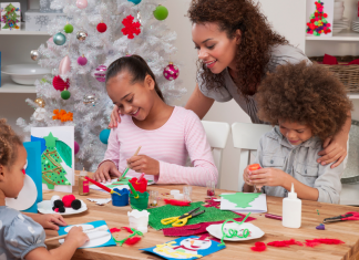 family making Christmas crafts together