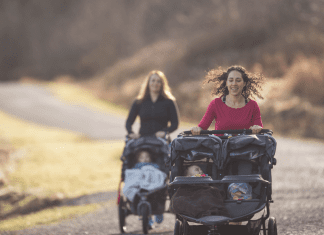 two women running with strollers
