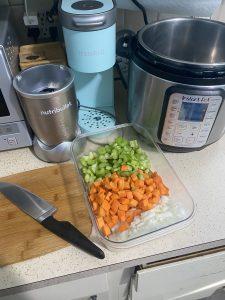 Chopped veggies in front of my Instant Pot on my cluttered counter